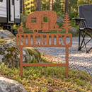 Campsite Custom Metal Sign in Copper hammered powdercoat, personalized with NIEMIEC and planted beside mossy stone at a pine woodland campsite.