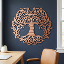 Celtic Tree of Life metal wall art in Copper with directional grinding marks on a navy wall above an oak desk.