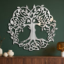 Celtic Tree of Life wall art in polished metal with directional grinding marks on a forest-green wall above a walnut sideboard.