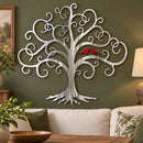 Curly Tree Of Life With Cardinals Metal Wall Art in Polished Metal With Red Cardinals finish, mounted on an indoor wall.