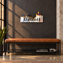 Detroit Skyline Metal Wall Art in Polished Metal With Torch, displayed in a Detroit-inspired interior.