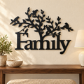 Family Tree With Birds metal wall art in Black finish displayed in a bright ivory entryway above a walnut console.