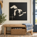 Great Lakes Metal Wall Art in Matte Black, featuring lake and compass cutouts in a coordinated indoor lakehouse setting.
