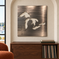 Great Lakes Metal Wall Art in Pewter, featuring lake and compass cutouts in a coordinated indoor lakehouse setting.