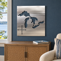 Great Lakes Metal Wall Art in Polished Metal, featuring lake and compass cutouts in a coordinated indoor lakehouse setting.