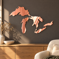 Great Lakes Silhouette metal wall art in Copper finish displayed in a warm living room above an oak sideboard.