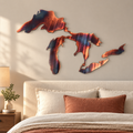 Great Lakes Silhouette metal wall art in Inferno finish displayed in a neutral bedroom above an ivory upholstered bed.
