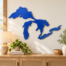 Great Lakes Silhouette metal wall art in Metallic Blue finish displayed in a bright entryway above a light oak console.