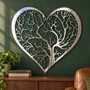 Heart Tree of Life metal wall art in polished silver metal on a forest green wall above a walnut cabinet.