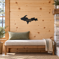 Michigan Upper Peninsula Metal Wall Art in Black, with HOME lettering cut out, displayed in a Northwoods-inspired interior.