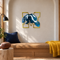 Michigan Wolverines Logo Metal Wall Art in Airbrushed Maize & Blue, displayed in an indoor college-football fan setting.