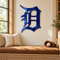 Old English D Metal Wall Art in Navy Blue, displayed in an indoor baseball fan setting.