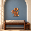 Praying Angel Metal Wall Art in Copper Bronze with directional grinding marks, displayed in a soft blue arched alcove above a walnut prayer kneeler.