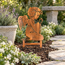 Copper Bronze Praying Angel metal garden art with directional grinding marks and two buried stakes beside a stone path and lavender.