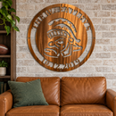 Sparty Monogram metal wall art in copper bronze displayed in a home interior.
