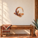 Tail Chasing Gecko Metal Wall Art in Copper Bronze with rainbow torch shading and directional grinding, displayed above a wood bench in a Southwestern entryway.